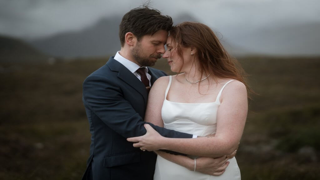 A couple embrace during their Scottish wedding elopement 